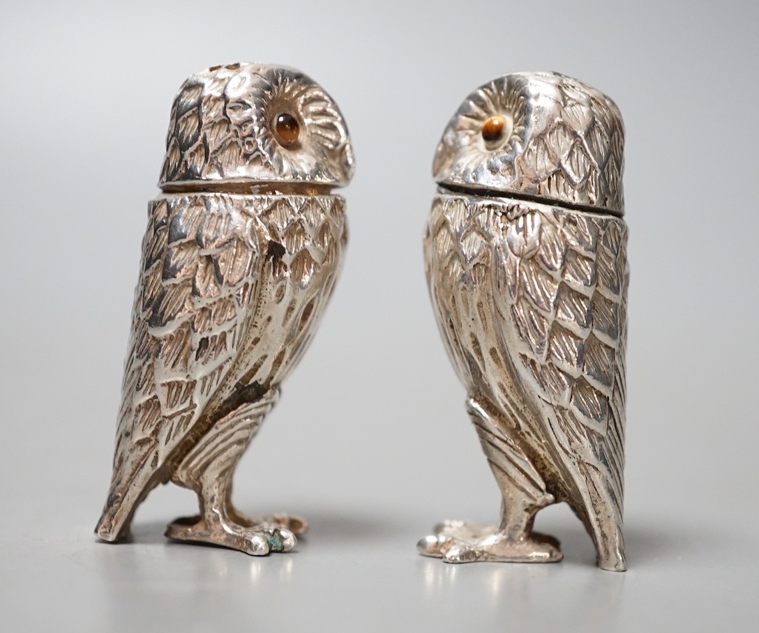 A modern novelty silver condiment, modelled as an owl and a similar unmarked companion, 52mm